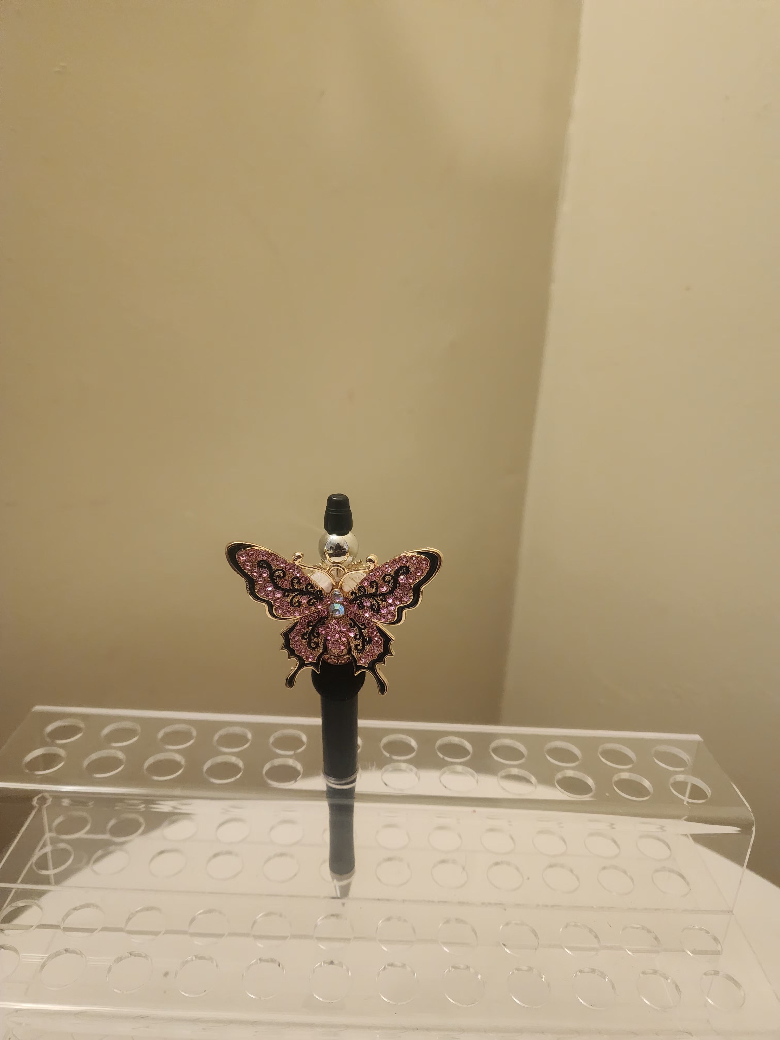 Pink and black butterfly pen